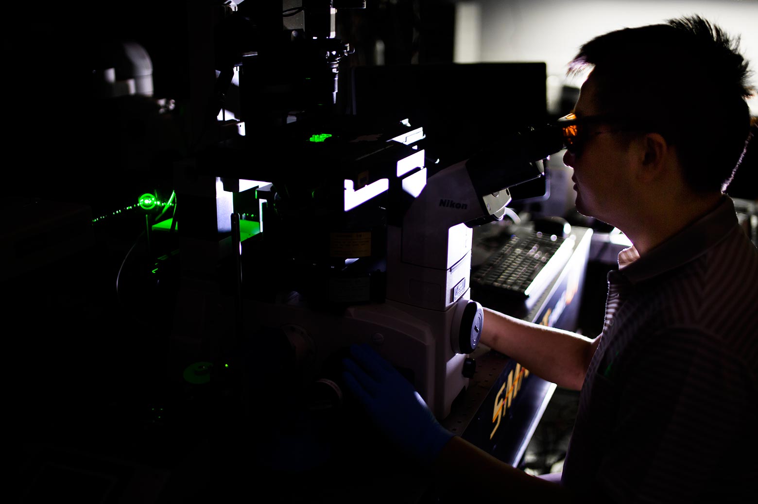 Scientist at work in a dark lab