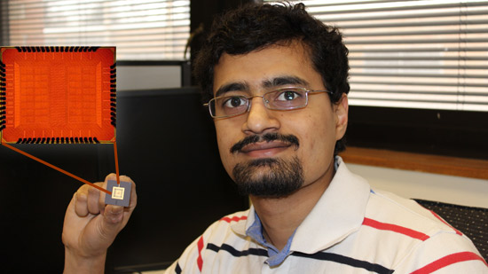 Bharan Giridhar holding a chip he designed