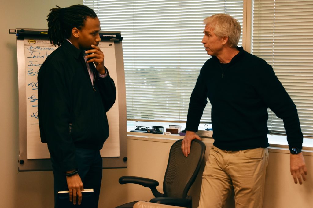PhD student Kwesi Rutelage talks with Bob Stefanski, one of the Managing Directors of eLab Ventures and a U-M alum.