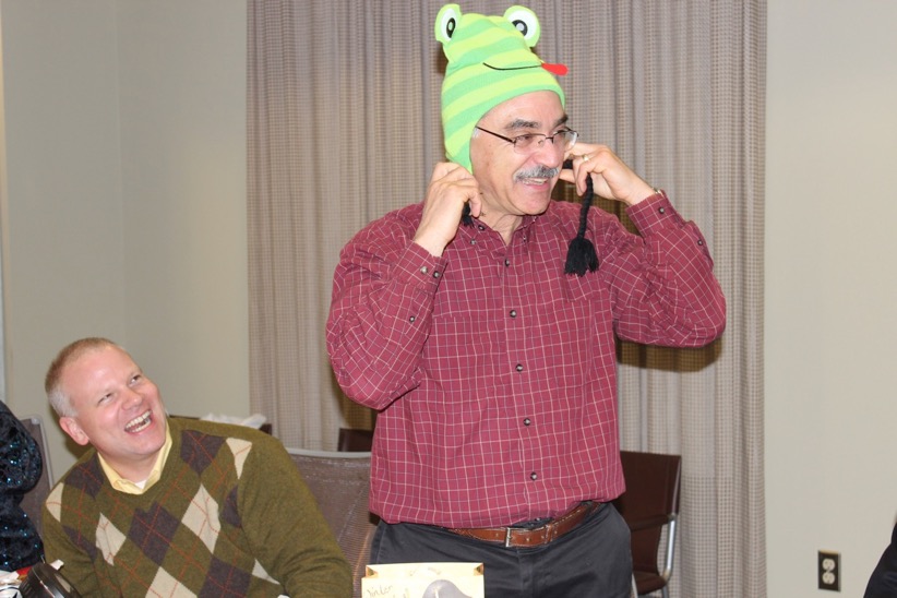 Prof. Neuhoff wears a funny frog hat and laughs