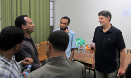 Prof. Austin speaks with students from a reading group.