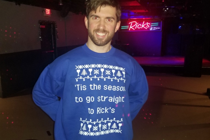 Sam June in sweater that says "Tis the season to go straight to Rick's"