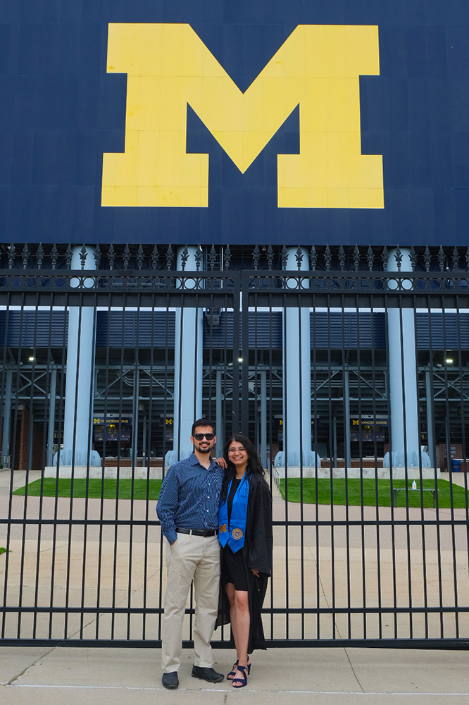 Rucha and her brother in front of Michigan Stadium