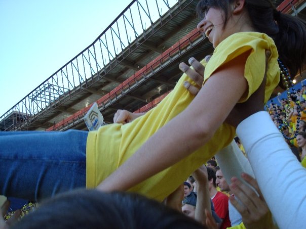 Katie Bouman being lifted by friends at Michigan football game