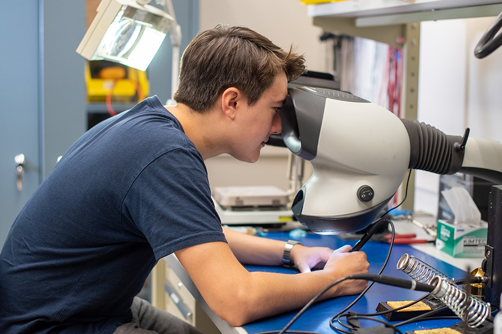 Trevor Odelberg working at his lab station