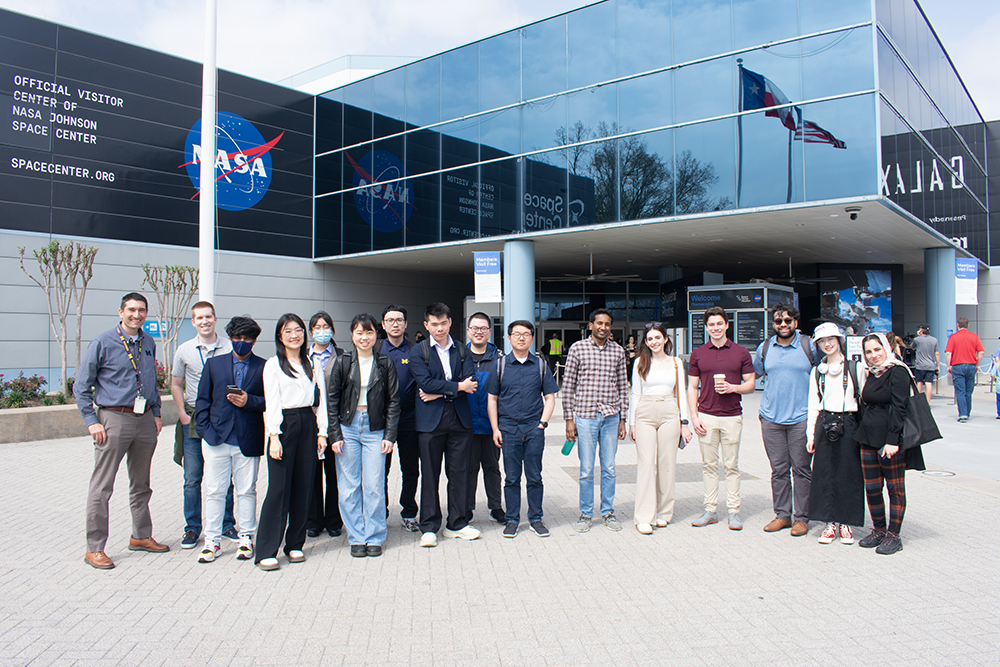 group photo outside the main entrance of NASA's Space Center Houston.