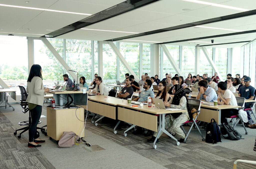 Picture of Dr. Q Vera Liao giving a lecture to a full audience
