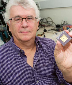 photo of Trevor Mudge holding a low-power chip