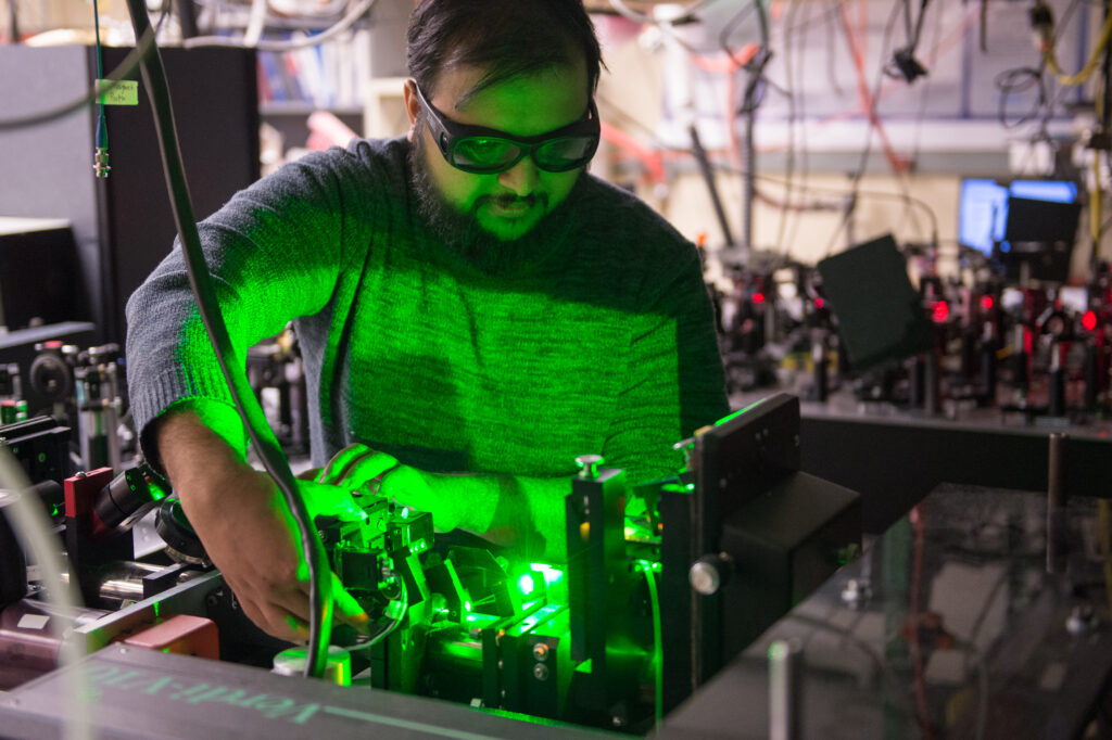 Student aligns a green laser