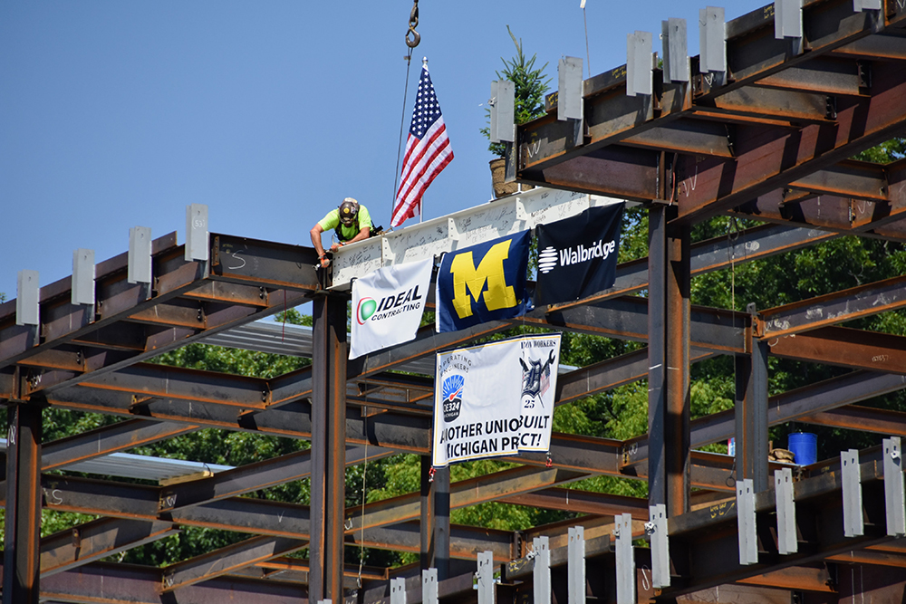 The beam is secured into place on the south side of the building.