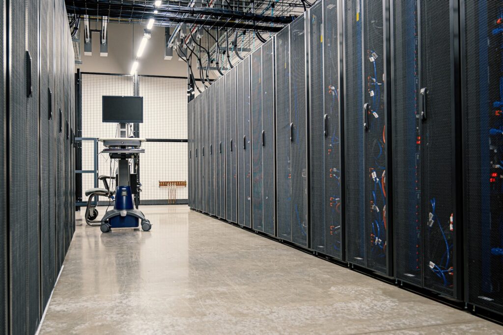A corridor in a data center lined with servers