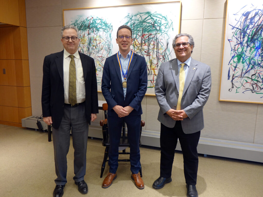 Prof. Halderman poses for a picture with Michael Wellman and Steve Ceccio.