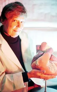Janice Jenkins holding a reproduction of a human heart