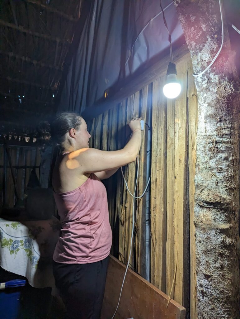 Amanda Liss installing a light switch