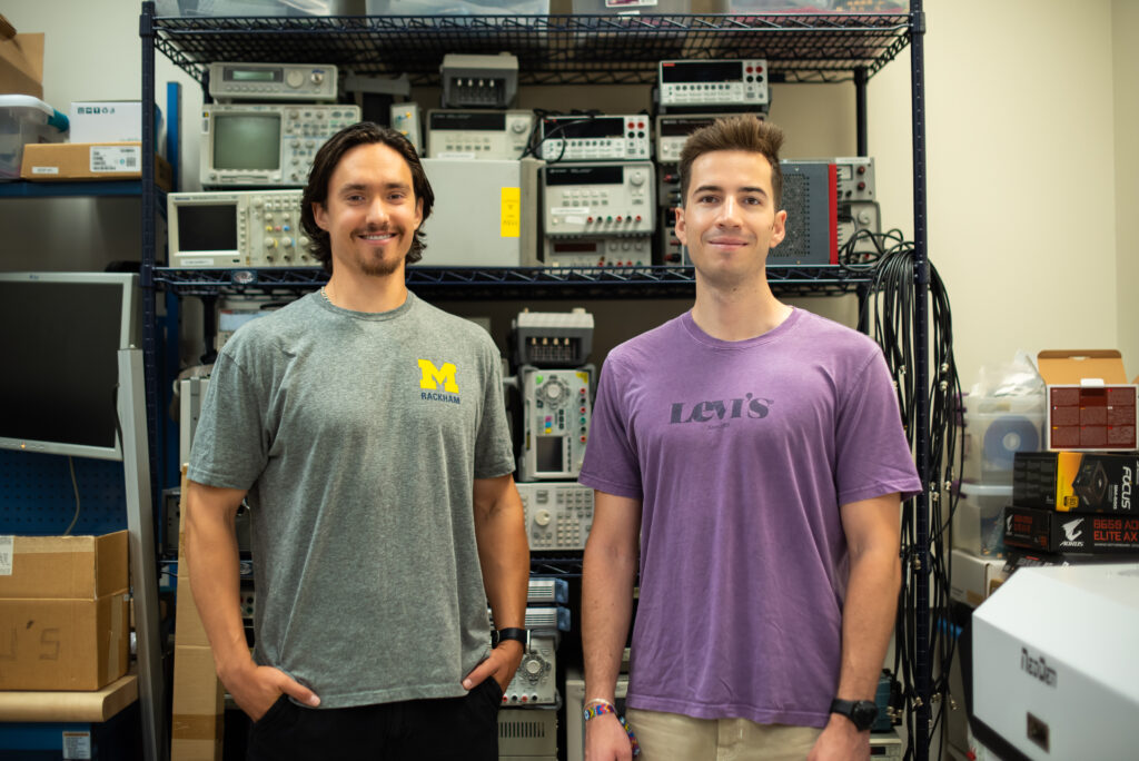 John Kustin and Vangelis Dikopoulos stand in their lab.