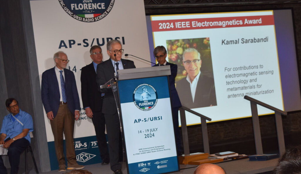 Kamal Sarabandi at podium after receiving IEEE Electromagnetics award